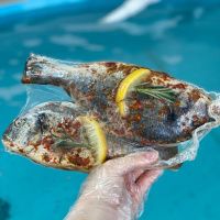 Дорада в оливковом масле с травами